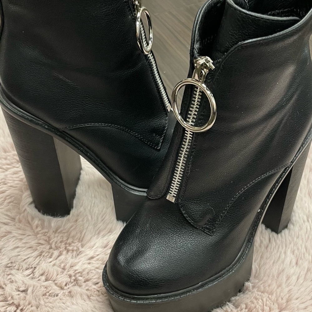 Black chunky boots with front zip